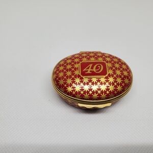 This Halcyon Days Enamels Red and Gold Decorative Trinket Box